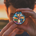 Person looking through a kaleidoscope