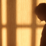 Shadow of woman looking side on